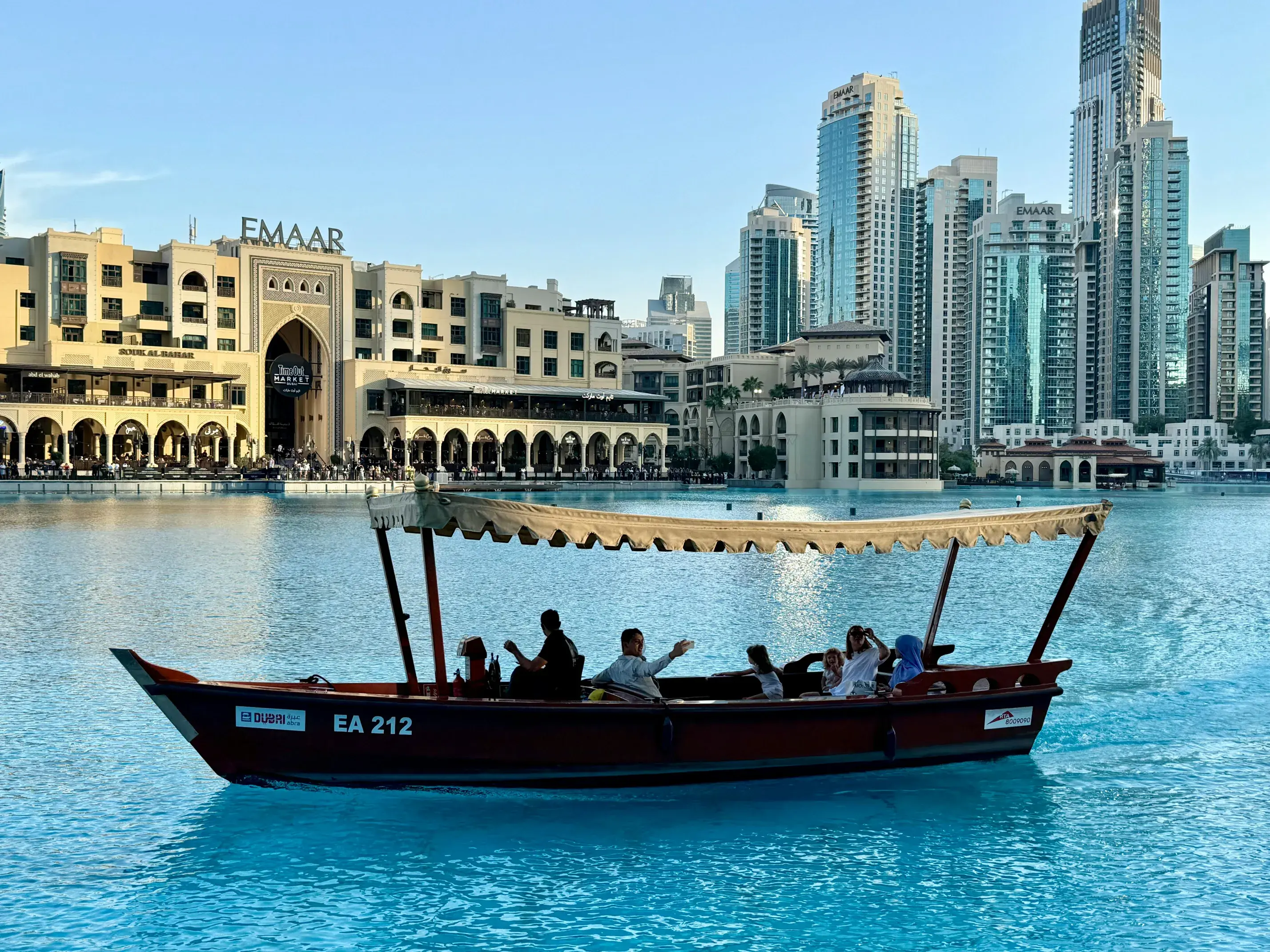 Traditional Boat Cruising Dubai Marina With Skyline